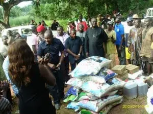 Members of ALGON in Enugu State and the items donated to one of the communities